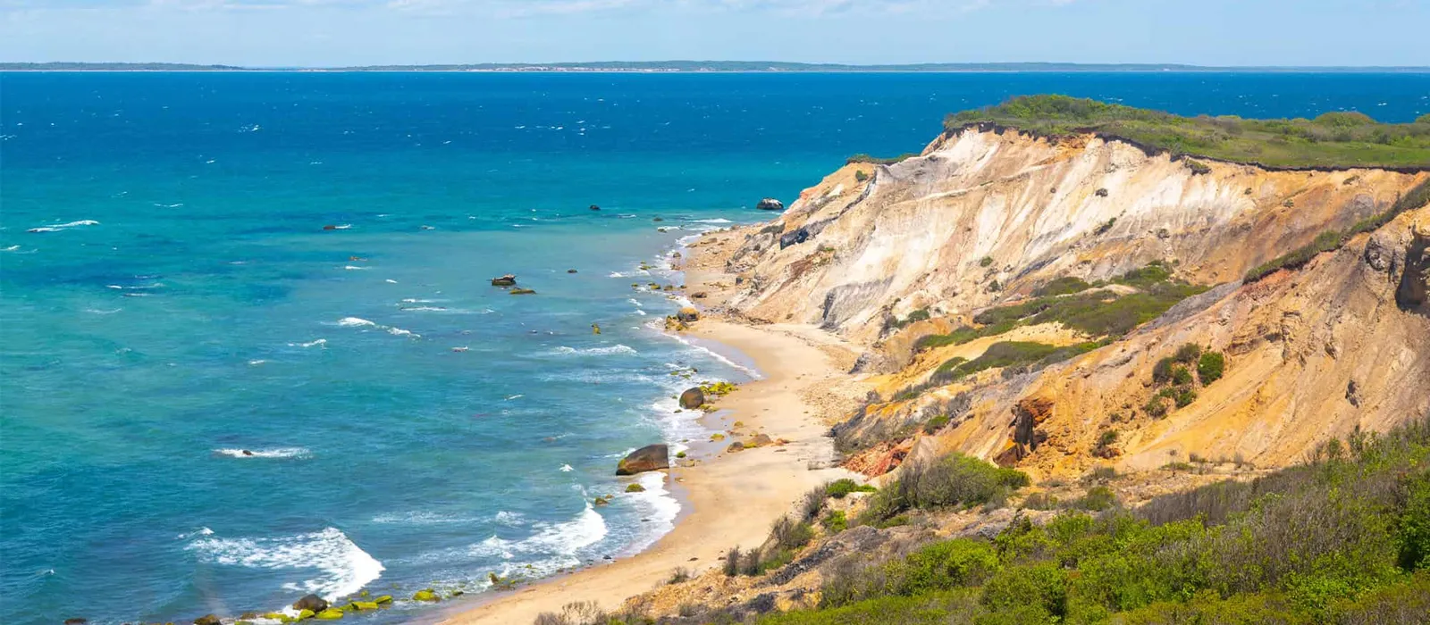 Colored clay cliffs above a beach