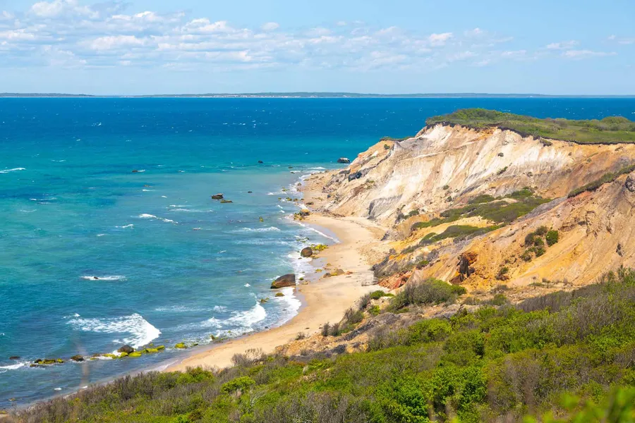 Colored clay cliffs above a beach