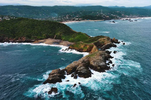 Rocky islets and surf seen from above