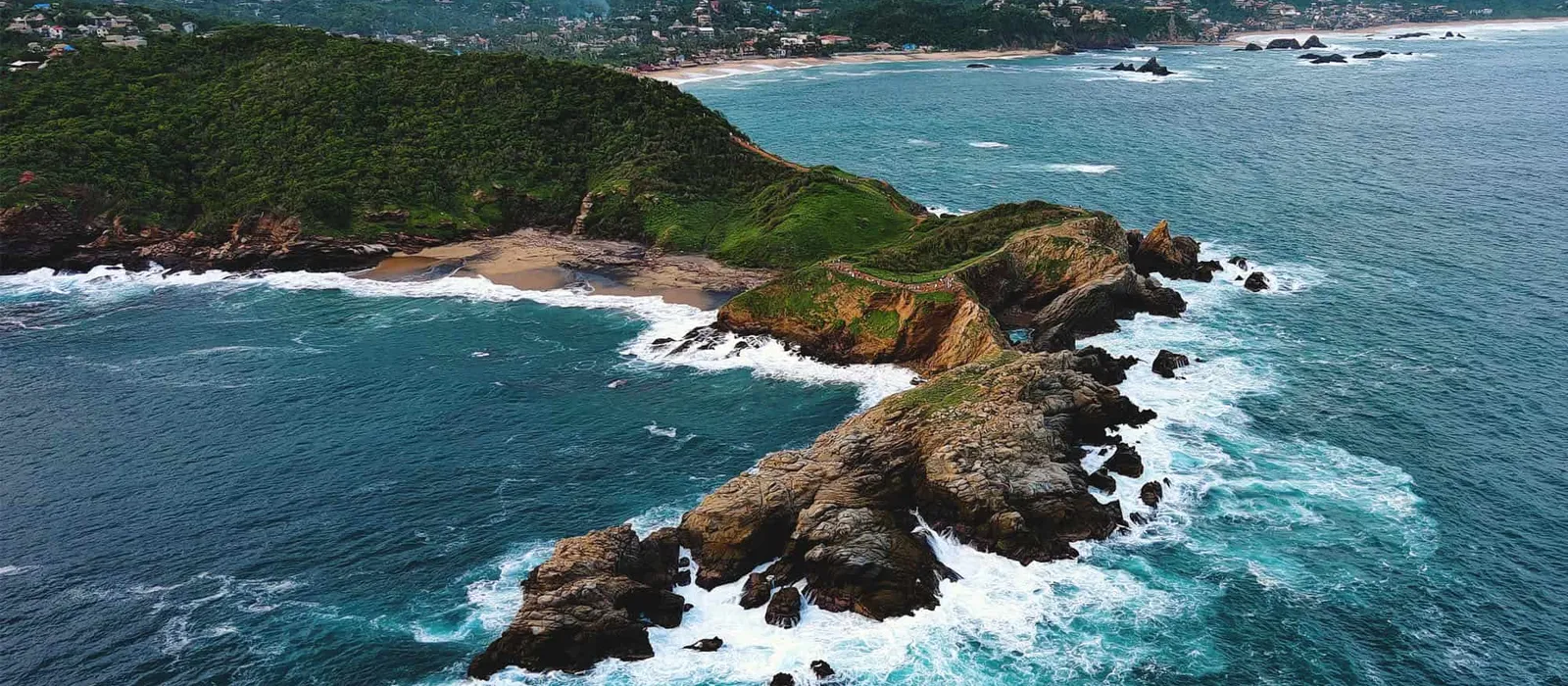 Rocky islets and surf seen from above