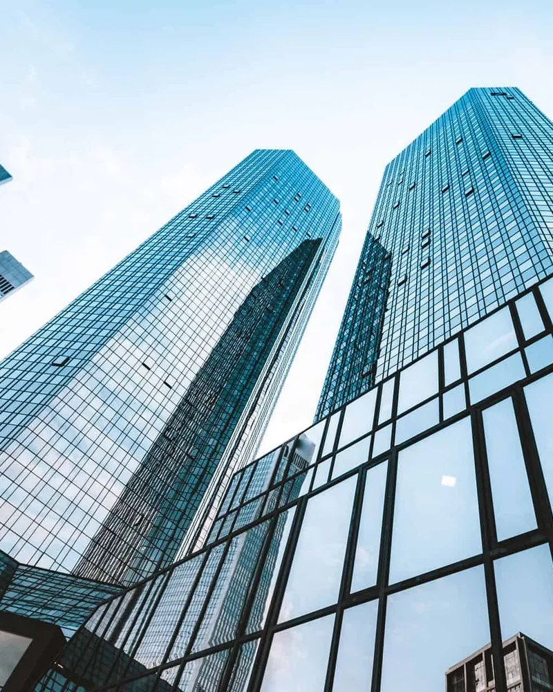 Glass office towers seen from street level