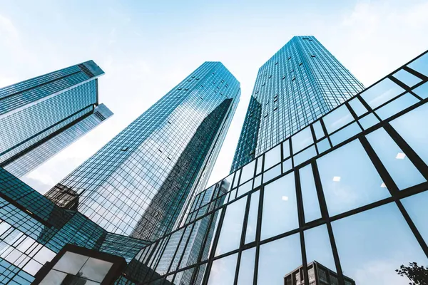 Glass office towers seen from street level