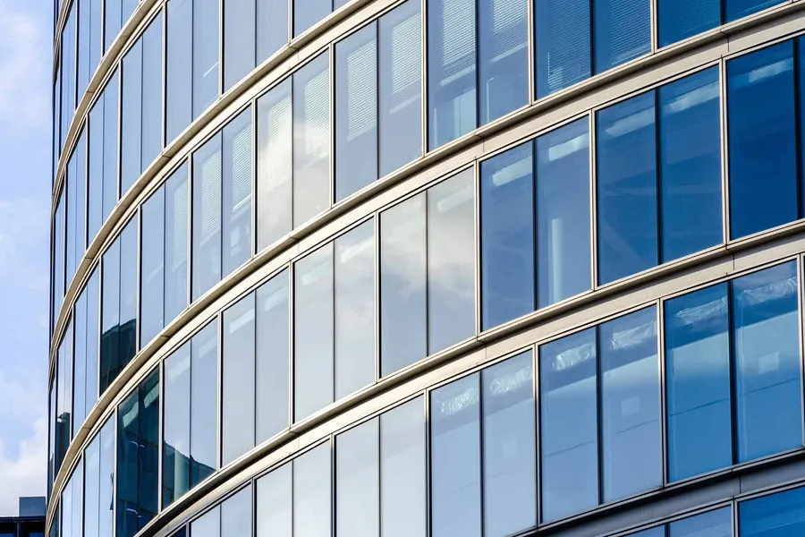 Curved glass facade of a city office building