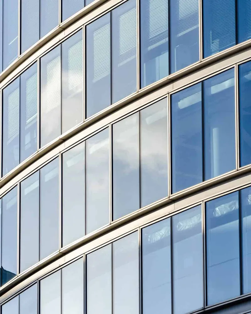 Curved glass facade of a city office building