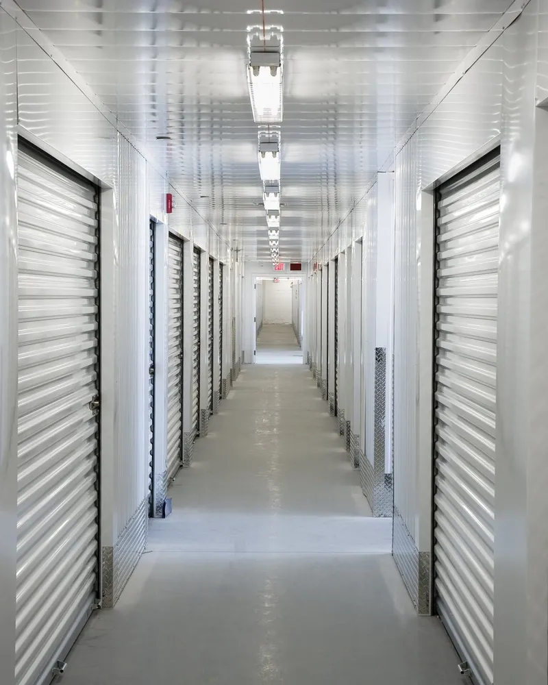 Corridor of roll-up doors inside a self storage facility