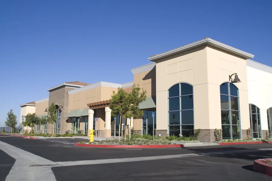 Single-storey retail center with tenant storefronts